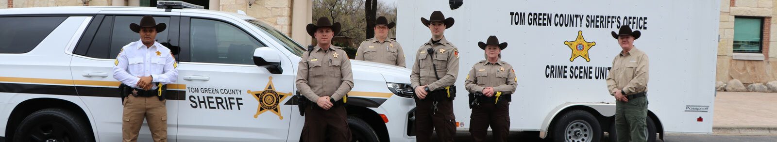 Tom Green County Sheriff Officers standing in front of vehicle and crime scene unit trailor